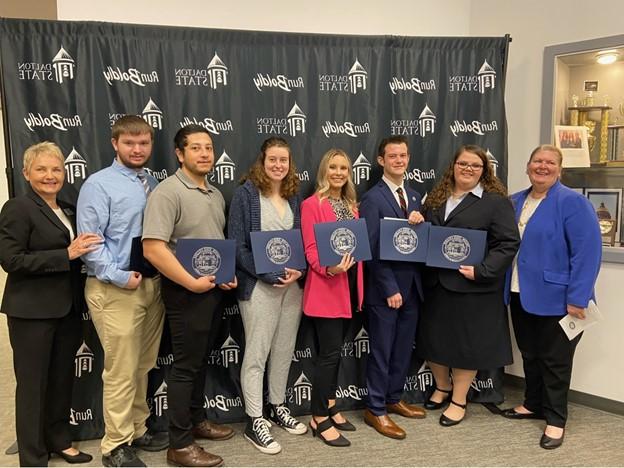 Students and mentors pose in a group photo during the Honors Convocation